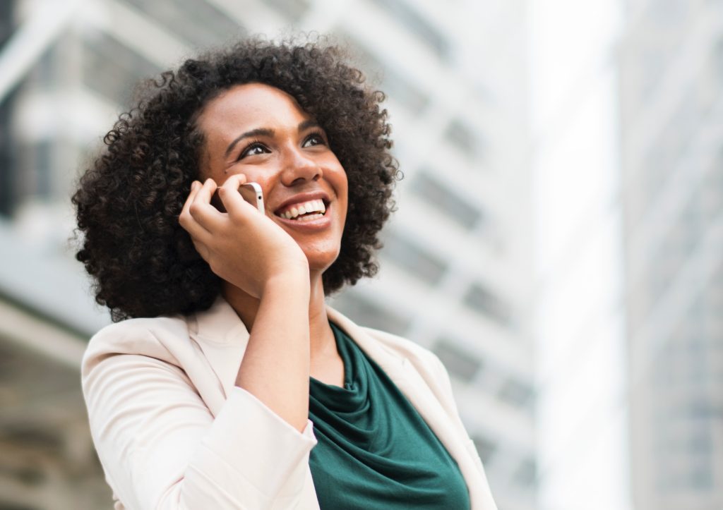 Person holding a mobile phone, ready to connect